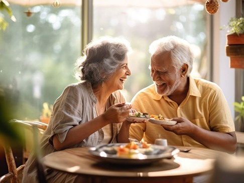 Happy older couple enjoying a meal together