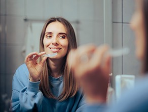 Older woman at work wearing dentures