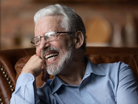 Laughing older man with dentures