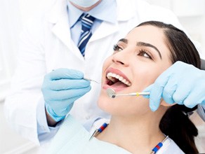 Closeup of woman smiling during dental checkup