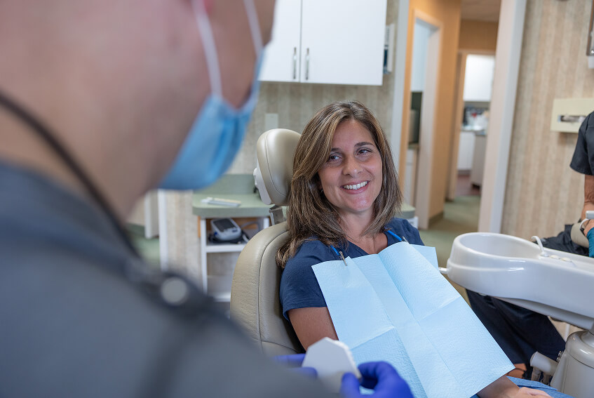 Smiling patient in dental chair